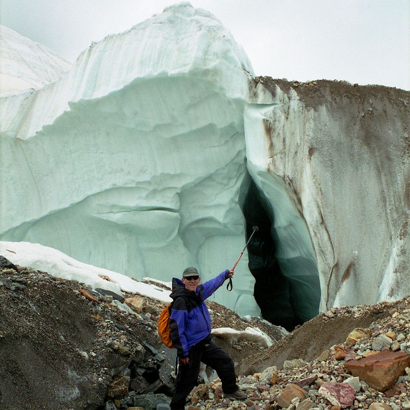 22 Jerome Ryan Points At True Glacier Below The Rubble On The Upper Baltoro Glacier We trekked back from Shagring camp to Concordia in cloudy weather, passing a side section of the Upper Baltoro Glacier that clearly shows that this isnt just rubble trekking trail, but a real glacier with ice.